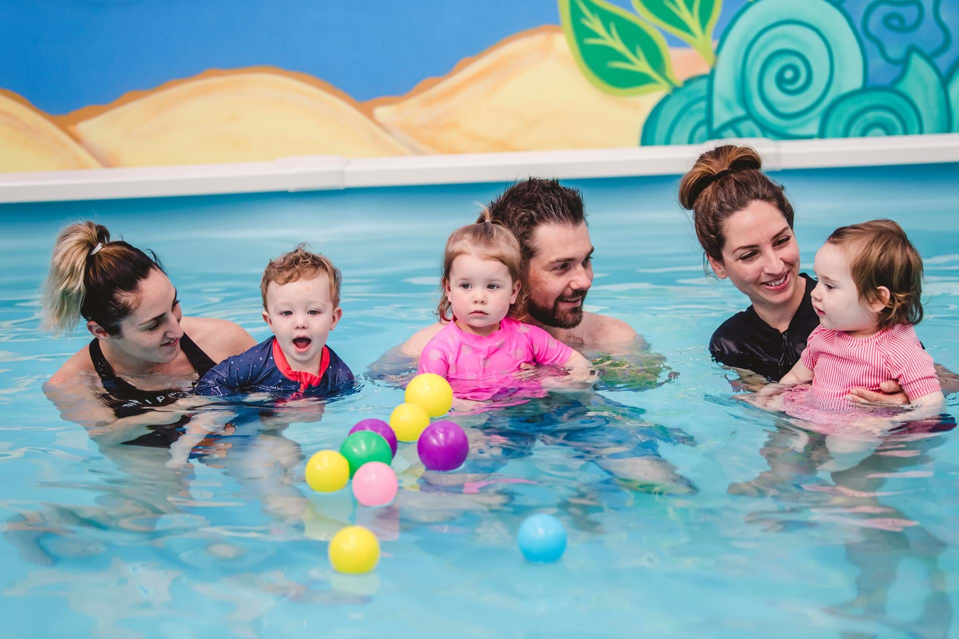 A child learning to swim at Little Swimmers Swim School